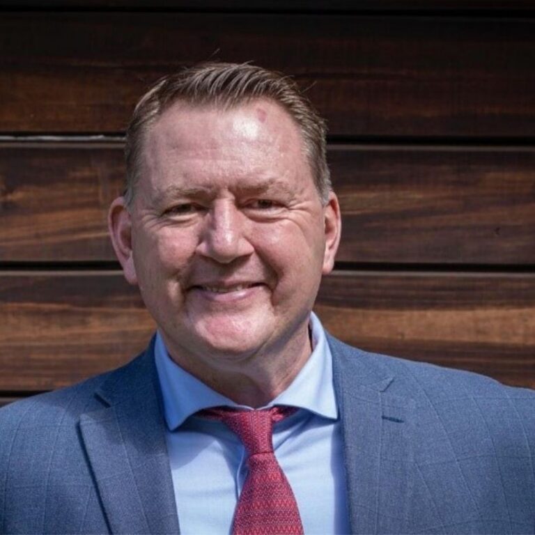 A man in a jacket, shirt and tie